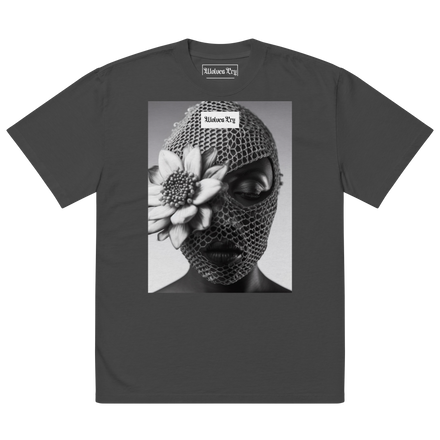 Product mockup of the Wolves Cry Oversized Balaclava Tee in vintage black, showcasing a bold graphic of a woman in a floral balaclava.