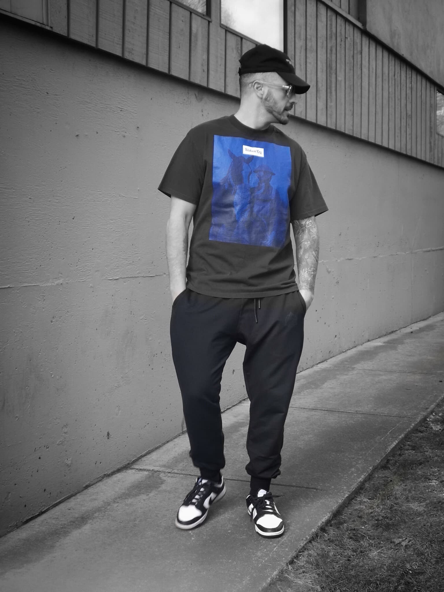 Model wearing the Wolves Cry Equestrian Blue Remix Tee, showcasing its oversized fit and bold blue artwork. A streetwear staple with a relaxed, pre-shrunk finish.